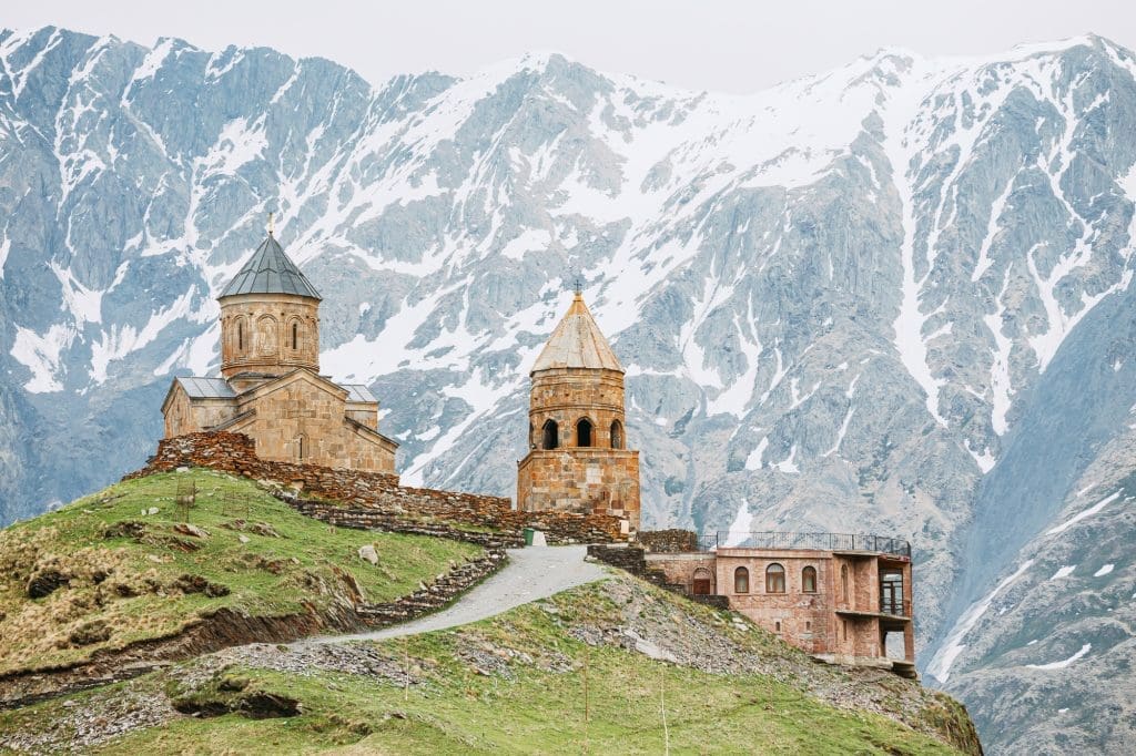 Stephantsminda, Georgia. Gergeti Trinity Church Or Tsminda Sameba - Holy Trinity Church Near Village